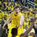 Michigan senior Matt Vogrich shouts and helps up freshman Glenn Robinson III during the game against Michigan State on Sunday, Mar. 3. Daniel Brenner I AnnArbor.com